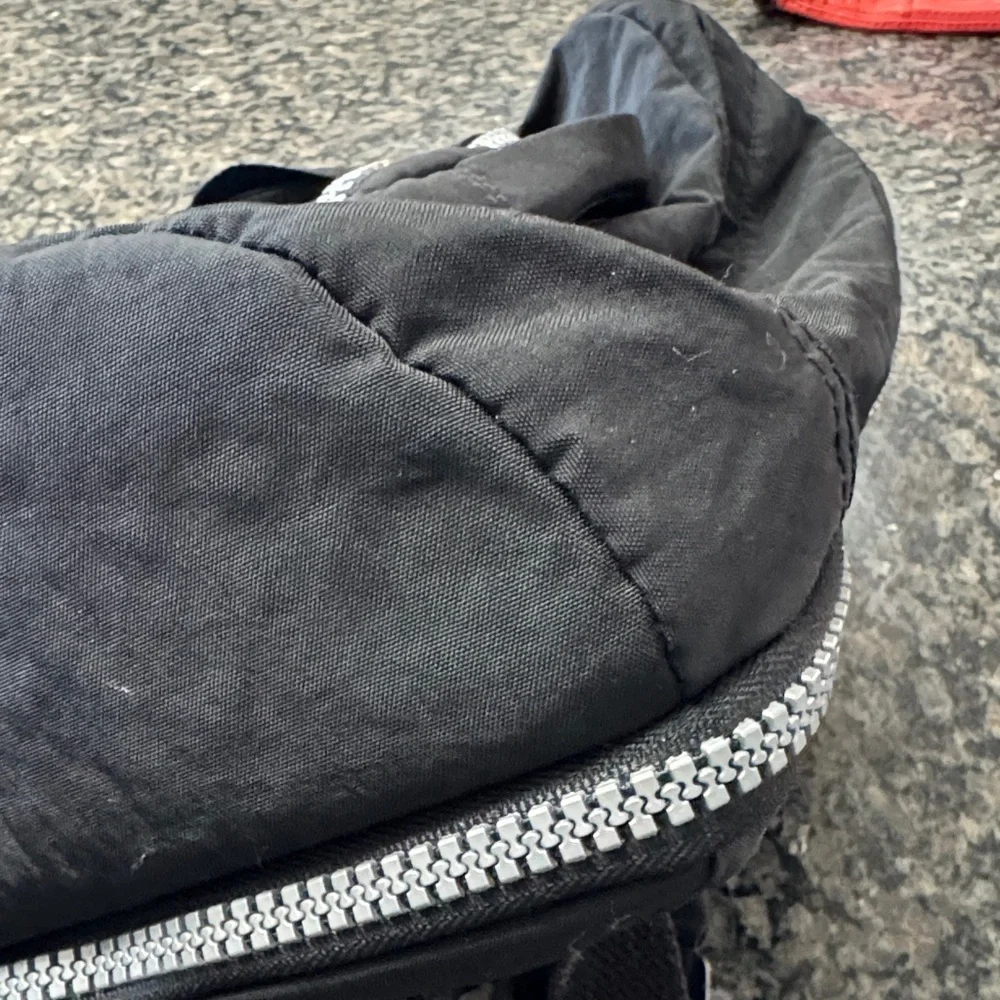 Kipling Hal Expandable Black Backpack with large Silver Accent zippers EUC